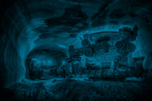 Mine personnel inspect progress in potash mine.