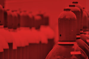 Large canisters of compressed gas in a warehouse.
